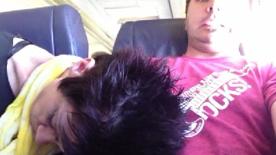 woman falls asleep on man's lap