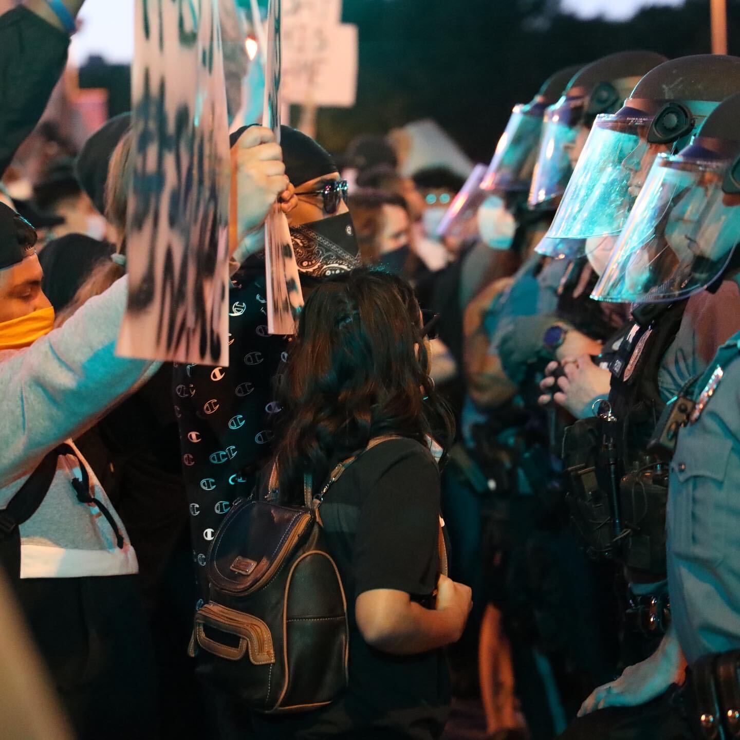 Picture of police clashing with protesters