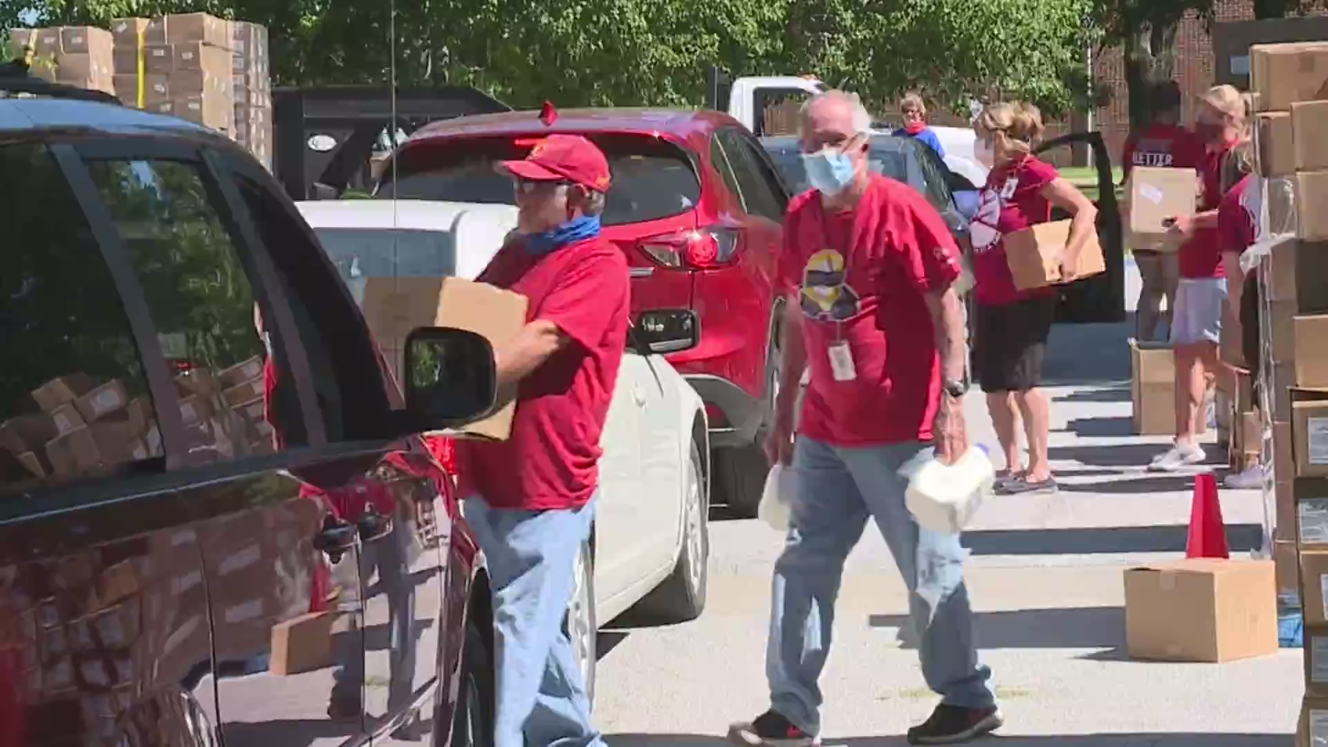 Picture of volunteers delivering food to cars